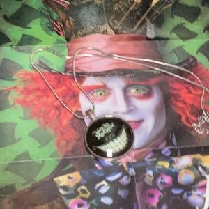 Glow in the dark cheshire cat necklace